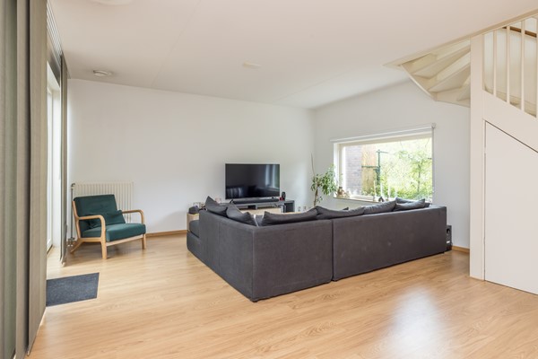 Foto - Te koop: Tussenwoning uit 2007 voorzien van een energielabel A met onder meer een ruime woon- en eetkamer, semi-open keuken, 3 slaapkamers, badkamer, carport en besloten (voor)tuin in Ransdaal